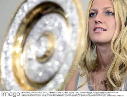 Czech Republic s Petra Kvitova poses with her second Ladies single trophy of the Wimbledon Championships in Prague, Czech Republic, on July 7, 2014. (CTKxPhoto MichalxKamaryt) CTKPhotoOF201407071109901  vnd 5