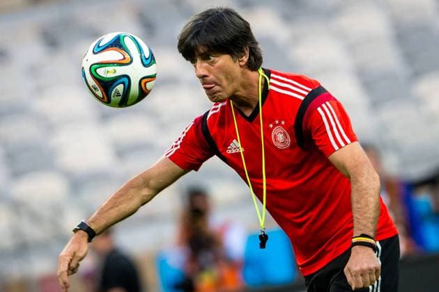 Joachim Löw, head coach of Germany kicks a ball ahead of a training session in Belo Horizonte, Brazil, on July 7, 2014. 