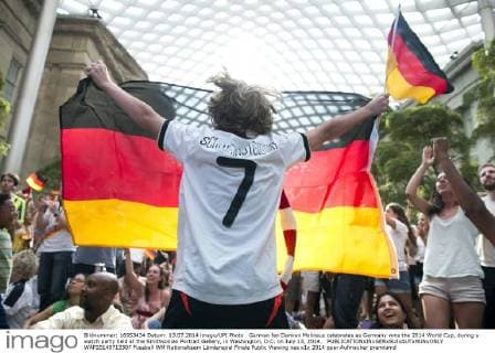 German fan Damian Molineus celebrates as Germany wins the 2014 World Cup, during a watch party held at the Smithsonian Portrait Gallery, in Washington, D.C. on July 13, 2014.  WAP20140713307