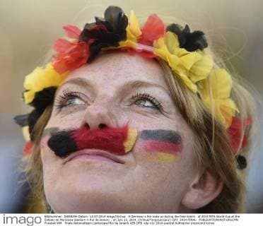 A Germany s fan looks on during the final match of 2014 FIFA World Cup at the Estadio do Maracana Stadium in Rio de Janeiro , on July 13, 2014. (Xinhua YangxLei)(pcy) (SP) 2014-FINAL- 