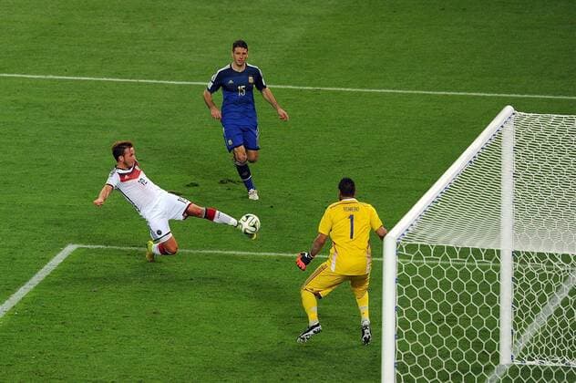 Mario Goetze of Germany scores the opening goal past Sergio Romero of Argentina during the 2014 FIFA World Cup Final at the Estadio do Maracana in Rio de Janeiro, Brazil on July 13, 2014.  RIO2014071301