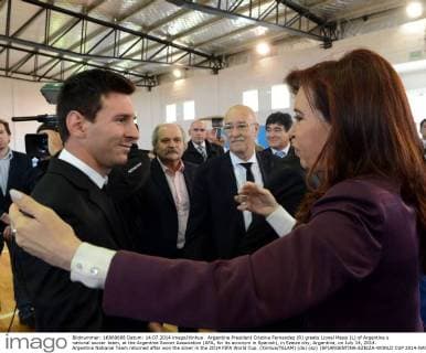 Argentine President Cristina Fernandez (R) greets Lionel Messi (L) of Argentina s national soccer team, at the Argentine Soccer Association (AFA, for its acronym in Spanish), in Ezeiza city, Argentina, on July 14, 2014. Argentina National Team returned after won the silver in the 2014 FIFA World Cup. (Xinhua TELAM) (da) (sp) (SP)ARGENTINA-EZEIZA-WORLD CUP 2014-NATIONAL TEAM 