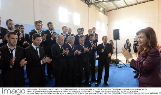 Argentine President Cristina Fernandez (R) cheers for Argentina s national soccer team, at the Argentine Soccer Association (AFA, for its acronym in Spanish), in Ezeiza city, Argentina, on July 14, 2014. Argentina National Team returned after won the silver in the 2014 FIFA World Cup. (Xinhua TELAM) (da) (sp) (SP)ARGENTINA-EZEIZA-WORLD CUP 2014-NATIONAL TEAM 