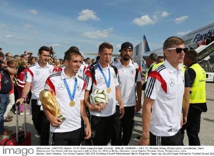 BERLIN, GERMANY - JULY 15: Miroslav Klose, Philipp Lahm, Lars Bender, Sami Khedira and Toni Kroos with the cup and a ball on July 15, 2014 in Berlin, Germany. Local Caption Miroslav Klose; Philipp Lahm; Lars Bender; Sami Khedira; Toni Kroos