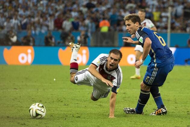 July 13, 2014 - Rio De Janeiro - RIO DE JANEIRO--13 July: Philipp Lahm (ger) and Lucas Biglia (arg) in match between Germany and Argentina, corresponding to the 2014 World Cup final, played at the Maracana Stadium, July 13, 2014.  - ZUMAn23