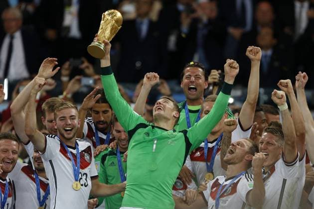 Football, Germany v Argentina. 2014 World Cup. The German players Manuel Neuer, Christoph Kramer celebrate with the trophy of the 2014 World Cup after the final match against Argentina held at the Maracana stadium in Rio de Janeiro. 13 07 2014 Football, Germany v Argentina. 