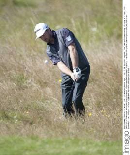 15.07.2014. Hoylake, England. The Open golf championship. Graeme MCDOWELL NIR chips out of the rough during his practice round. xStephenxBartholomewx  ActionPlus11541956
