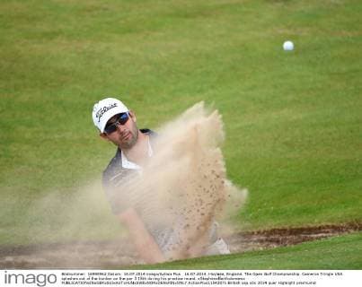 16.07.2014. Hoylake, England. The Open Golf Championship. Cameron Tringle USA splashes out of the bunker on the par 3 15th during his practice round. xStephenxBartholomewx  ActionPlus11542071
