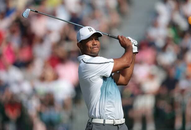 American Tiger Woods tees off on the 5th hole on the first day of the 2014 Open Golf Championships in Hoylake on July 17, 2014.  LON2014071707