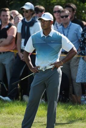 American Tiger Woods on the 7th green on the first day of the 2014 Open Golf Championships in Hoylake on July 17, 2014.  LON2014071708