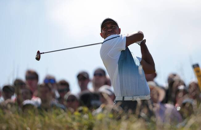 American Tiger Woods tees off on the 11th hole on the first day of the 2014 Open Golf Championships in Hoylake on July 17, 2014.  LON2014071718