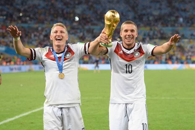 v.li:Bastian SCHWEINSTEIGER (GER),Lukas PODOLSKI (GER),Aktion,Jubel,Freude,Begeisterung,Siegerehrung,mit Pokal,Trophy,Trophäe,Cup, Deutschland (GER))-Argentinien (ARG) 1-0 n.V Finale,Final,Spiel 64, am 13.07.2014 in Rio de Janeiro. Fussball Weltmeisterschaft 2014 in Brasilien vom 12.06. - 13.07.2014.