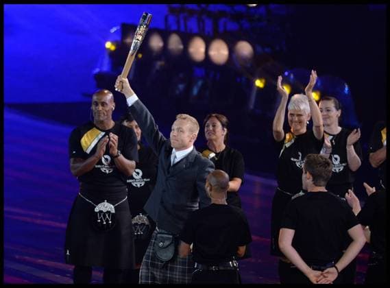 23 07 2014. Glasgow, United Kingdom. Sir Chris Hoy carries the Queens Baton to HM The Queen during the opening ceremony of the Commonwealth Games in Glasgow..  xAndrewxParsonsx xixImagesx IIM-2686-0128