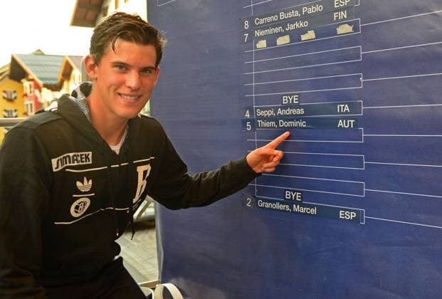 TENNIS - ATP, bet-at-home Cup 2014 KITZBÜHEL,AUSTRIA,25.JUL.14 - TENNIS - ATP Tennis Herren World Tour, bet-at-home Cup, draw. Image shows Dominic Thiem (AUT) and the draw board. 