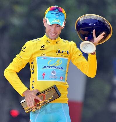 Race winner Astana team rider Vincenzo Nibali of Italy reacts on the podium after the 137.5 km final stage of the 2014 Tour de France in Paris, France, on July 27, 2014. (Xinhua Chen Xiaowei) (SP)FRANCE-PARIS-TOUR DE FRANCE 