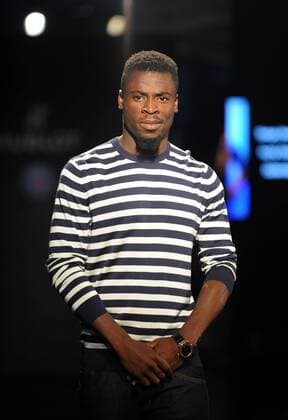 Serge Aurier of France s Paris Saint-Germain Football Club poses at a fashion show of Swiss watch brand Hublot during the Asia tour of the club in Hong Kong, China, 27 July 2014. Paris Saint-Germain football stars wow fans at watch fashion show in Hong Kong  20140727_10774