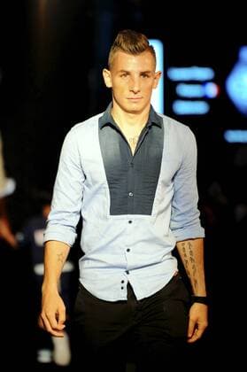 Lucas Digne of France s Paris Saint-Germain Football Club parades at a fashion show of Swiss watch brand Hublot during the Asia tour of the club in Hong Kong, China, 27 July 2014. Paris Saint-Germain football stars wow fans at watch fashion show in Hong Kong  20140727_30686