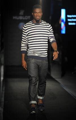 Serge Aurier of France s Paris Saint-Germain Football Club parades at a fashion show of Swiss watch brand Hublot during the Asia tour of the club in Hong Kong, China, 27 July 2014. Paris Saint-Germain football stars wow fans at watch fashion show in Hong Kong  20140727_30688
