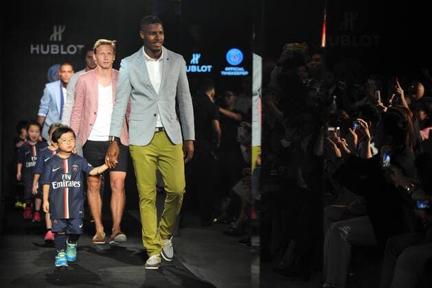 Football stars of France s Paris Saint-Germain Football Club parade with little kids at a fashion show of Swiss watch brand Hublot during the Asia tour of the club in Hong Kong, China, 27 July 2014. Paris Saint-Germain football stars wow fans at watch fashion show in Hong Kong  20140727_46329