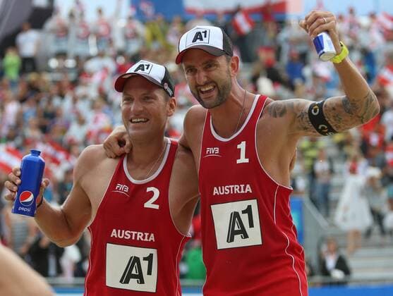 BEACH VOLLEYBALL - FIVB, Grand Slam Klagenfurt KLAGENFURT,AUSTRIA,31.JUL.14 - BEACH VOLLEYBALL - FIVB World Tour 2014, Grand Slam Klagenfurt. Image shows the rejoicing of Alexander Horst and Clemens Doppler (AUT). 