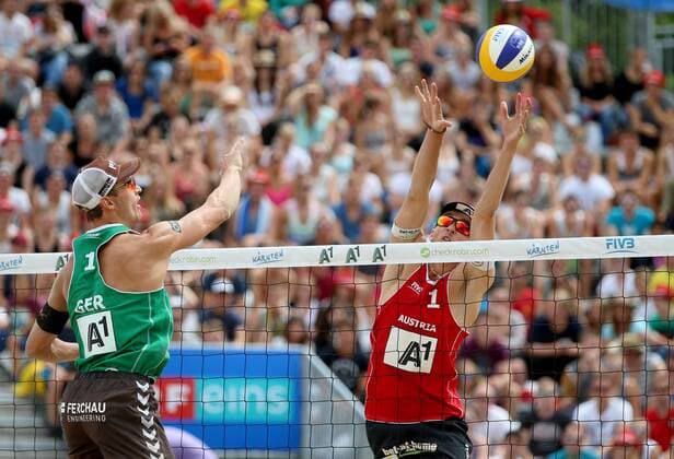 BEACH VOLLEYBALL - FIVB, Grand Slam Klagenfurt KLAGENFURT,AUSTRIA,31.JUL.14 - BEACH VOLLEYBALL - FIVB World Tour 2014, Grand Slam Klagenfurt. Image shows Mischa Urbatzka (GER) and Robin Seidl (AUT). 