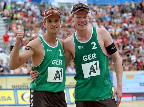BEACH VOLLEYBALL - FIVB, Grand Slam Klagenfurt KLAGENFURT,AUSTRIA,31.JUL.14 - BEACH VOLLEYBALL - FIVB World Tour 2014, Grand Slam Klagenfurt. Image shows the rejoicing of Mischa Urbatzka and Markus Böckmann (GER)). 