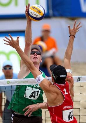 BEACH VOLLEYBALL - FIVB, Grand Slam Klagenfurt KLAGENFURT,AUSTRIA,31.JUL.14 - BEACH VOLLEYBALL - FIVB World Tour 2014, Grand Slam Klagenfurt. Image shows Markus Böckermann (GER) and Robin Seidl (AUT). 