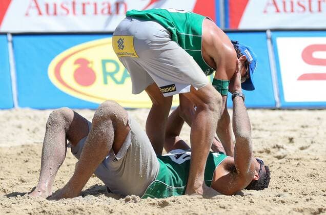 BEACH VOLLEYBALL - FIVB, Grand Slam Klagenfurt KLAGENFURT,AUSTRIA,01.AUG.14 - BEACH VOLLEYBALL - FIVB World Tour 2014, Grand Slam Klagenfurt. Image shows the rejoicing of Emanule Rego and Pedro Solberg Salgado (BRA). 