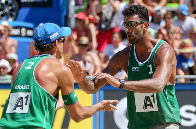 BEACH VOLLEYBALL - FIVB, Grand Slam Klagenfurt KLAGENFURT,AUSTRIA,01.AUG.14 - BEACH VOLLEYBALL - FIVB World Tour 2014, Grand Slam Klagenfurt. Image shows the rejoicing of Emanule Rego and Pedro Solberg Salgado (BRA). 