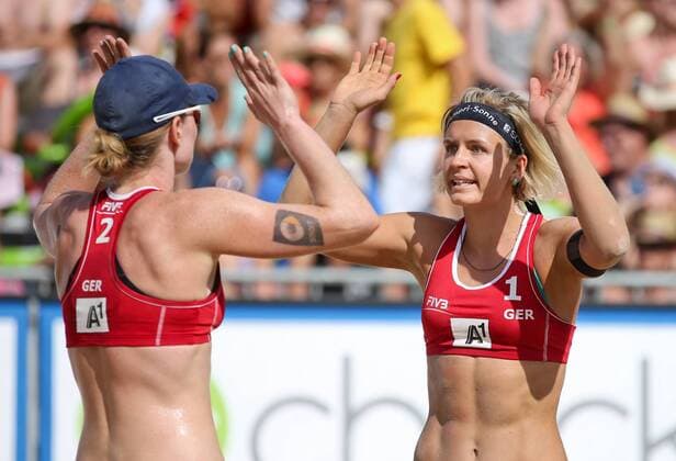 BEACH VOLLEYBALL - FIVB, Grand Slam Klagenfurt KLAGENFURT,AUSTRIA,01.AUG.14 - BEACH VOLLEYBALL - FIVB World Tour 2014, Grand Slam Klagenfurt. Image shows the rejoicing of Julia Sude and Laura Ludwig (GER). 