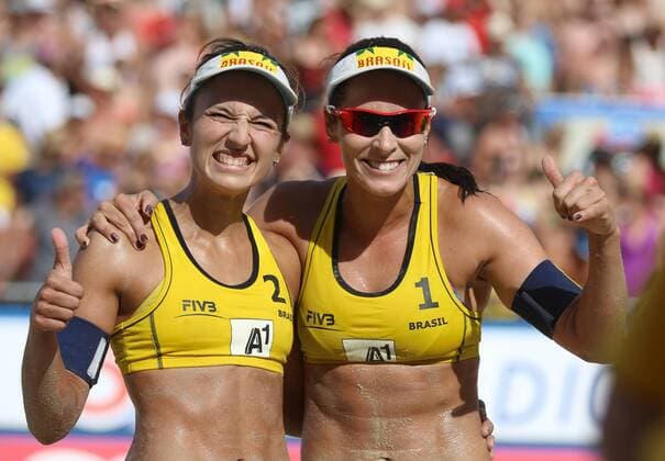BEACH VOLLEYBALL - FIVB, Grand Slam Klagenfurt KLAGENFURT,AUSTRIA,01.AUG.14 - BEACH VOLLEYBALL - FIVB World Tour 2014, Grand Slam Klagenfurt. Image shows the rejoicing of Barbara Seixas de Freitas and Agatha Bednarczuk (BRA). 