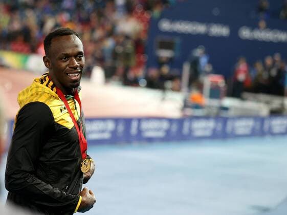 Usain Bolt of Jamaica reacts during the awarding ceremony for the men s 4X100m relay final of Athletics at the 2014 Glasgow Commonwealth Games in Hampden Park in Glasgow, Scotland on Aug. 2, 2014. Jamaica won the gold medal with a time of 37.58 seconds. ) (SP)BRITAIN-GLASGOW-COMMONWEALTH GAMES-ATHLETICS HanxYan 