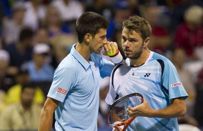 TORONTO, Aug. 4, 2014 -- Novak Djokovic (L) of Serbia speaks to Stanislas Wawrinka of Switzerland during the first round of men s doubles at the 2014 Rogers Cup in Toronto, Canada, Aug. 4, 2014. (SP)CANADA-TORONTO-TENNIS-ROGERS CUP-MEN S DOUBLES ZouxZheng 