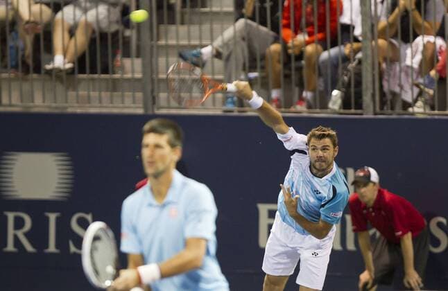 TORONTO, Aug. 4, 2014 -- Novak Djokovic (L) of Serbia and Stanislas Wawrinka of Switzerland compete during the first round of men s doubles at the 2014 Rogers Cup in Toronto, Canada, Aug. 4, 2014. (SP)CANADA-TORONTO-TENNIS-ROGERS CUP-MEN S DOUBLES ZouxZheng 