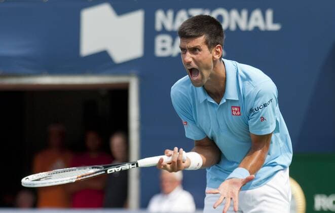 Novak Djokovic of Serbia reacts during the second round of men s singles at the 2014 Rogers Cup in Toronto, Canada, Aug. 6, 2014. CANADA-TORONTO-TENNIS-ROGERS CUP-MEN S SINGLES ZouxZheng 