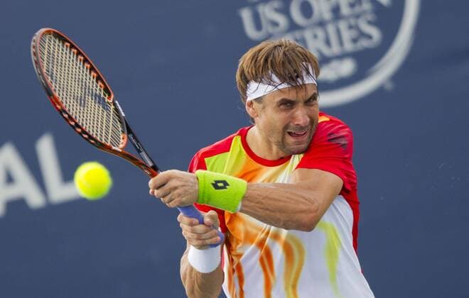 David Ferrer of Spain returns the ball during the second round of men s singles at the 2014 Rogers Cup in Toronto, Canada, Aug. 6, 2014. CANADA-TORONTO-TENNIS-ROGERS CUP-MEN S SINGLES ZouxZheng 