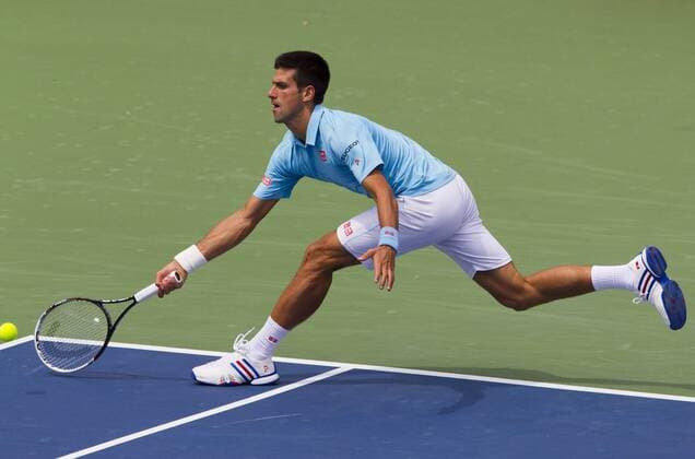 Novak Djokovic of Serbia returns the ball during the second round of men s singles at the 2014 Rogers Cup in Toronto, Canada, Aug. 6, 2014. CANADA-TORONTO-TENNIS-ROGERS CUP-MEN S SINGLES ZouxZheng 