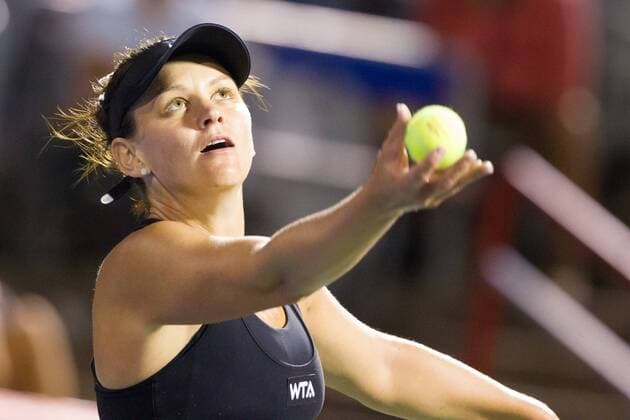 AUG 06, 2014 : Casey Dellacqua (AUS) serves during her game in the 2nd round of the Rogers Cup presented by National Bank at Uniprix Stadium in Montreal, Quebec, Canada. TENNIS: AUG 06 Rogers Cup - woman Montreal Icon10173 EDITORIAL USE ONLY