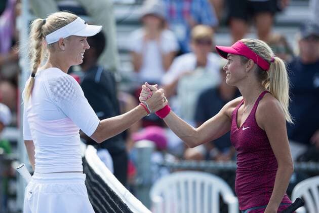 AUG 06, 2014 : Caroline Wozniacki (DEN) shakes hands with Klara Koukalova (CZE) before their game in the 2nd round of the Rogers Cup presented by National Bank at Uniprix Stadium in Montreal, Quebec, Canada. TENNIS: AUG 06 Rogers Cup - woman Montreal Icon14080612 EDITORIAL USE ONLY