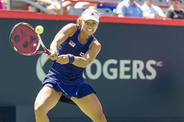 06 August 2014: Angelique Kerber of Germany hits a return during the second round of the Rogers Cup Presented by National Bank at Uniprix Stadium in Montreal, Quebec, Canada. TENNIS: AUG 06 Rogers Cup - woman Montreal Icon140806010 EDITORIAL USE ONLY