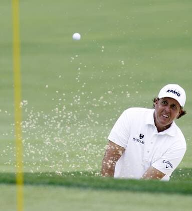 Phil Mickelson blasts out of a greenside bunker on the 17th hole during the first round of the 96th PGA Golf Herren Championship at Valhalla Country Club on August 7, 2014 in Louisville, Kentucky.  LOU2014080708