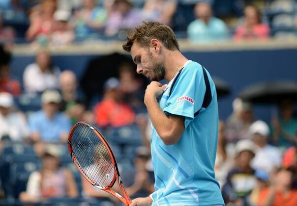 Stanislas Wawrinka (SUI) blickt enttäuscht zu Boden. Rogers Cup 2014, Toronto, Canada