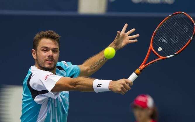 Stanislas Wawrinka of Switzerland returns the ball during the third round of men s singles at the 2014 Rogers Cup in Toronto, Canada, Aug. 7, 2014. 
