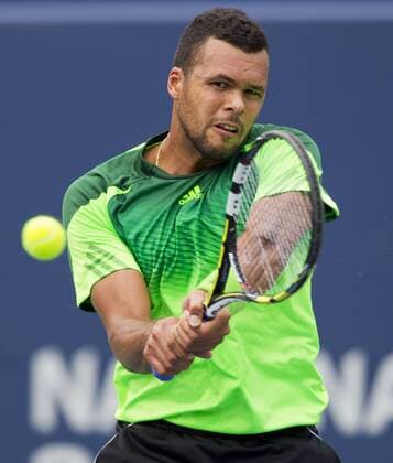 Jo-Wilfried Tsonga of France returns the ball during the third round of men s singles at the 2014 Rogers Cup in Toronto, Canada, Aug. 7, 2014. 
