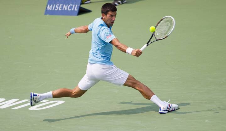 Novak Djokovic of Serbia returns the ball during the third round of men s singles at the 2014 Rogers Cup in Toronto, Canada, Aug. 7, 2014. 