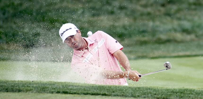 Ryan Palmer, of the United States, blasts out of a greenside bunker on the seventh hole during the first round of the 96th PGA Golf Herren Championship at Valhalla Country Club on .August 7, 2014 in Louisville, Kentucky. Westwood sank the birdie to shoot a six-under 65 and currently has a one stroke lead.  LOU2014080717