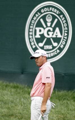 Ryan Palmer, of the United States, watches his second shot land on the eighth green during the first round of the 96th PGA Golf Herren Championship at Valhalla Country Club on .August 7, 2014 in Louisville, Kentucky. Westwood sank the birdie to shoot a six-under 65 and currently has a one stroke lead.  LOU2014080718