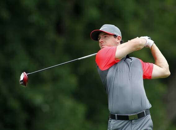 Rory McIlroy, of Northern Ireland, watches hit tee shot on the fifth hole during the first round of the 96th PGA Golf Herren Championship at Valhalla Country Club on .August 7, 2014 in Louisville, Kentucky. Westwood sank the birdie to shoot a six-under 65 and currently has a one stroke lead.  LOU2014080719