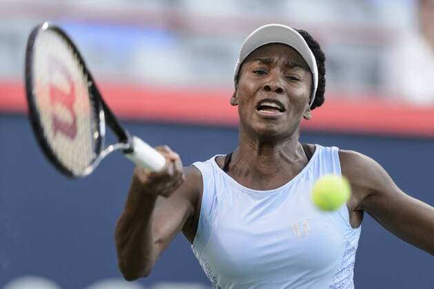 07 August 2014: Venus Williams of the United States hits a return during the third round of the Rogers Cup Presented by National Bank at Uniprix Stadium in Montreal, Quebec, Canada. Icon10619 EDITORIAL USE ONLY