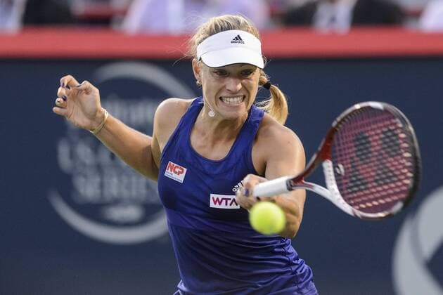 07 August 2014: Angelique Kerber of Germany hits a return during the third round of the Rogers Cup Presented by National Bank at Uniprix Stadium in Montreal, Quebec, Canada. Icon10620 EDITORIAL USE ONLY